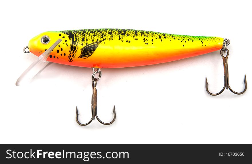 Studio shot of minnow shaped fishing lure isolated on white
