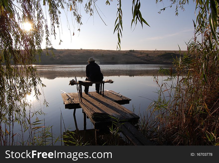 Fisherman on the lake during the dawn. Fisherman on the lake during the dawn