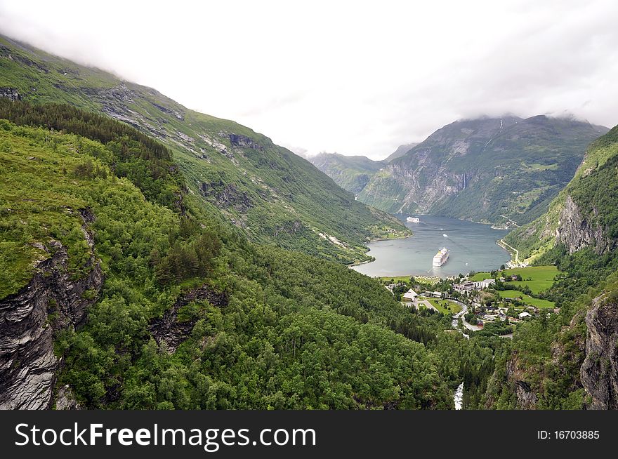 The geiranger fjord in Norway with two cruise ships leaving. On the UNESCO list of world herritage