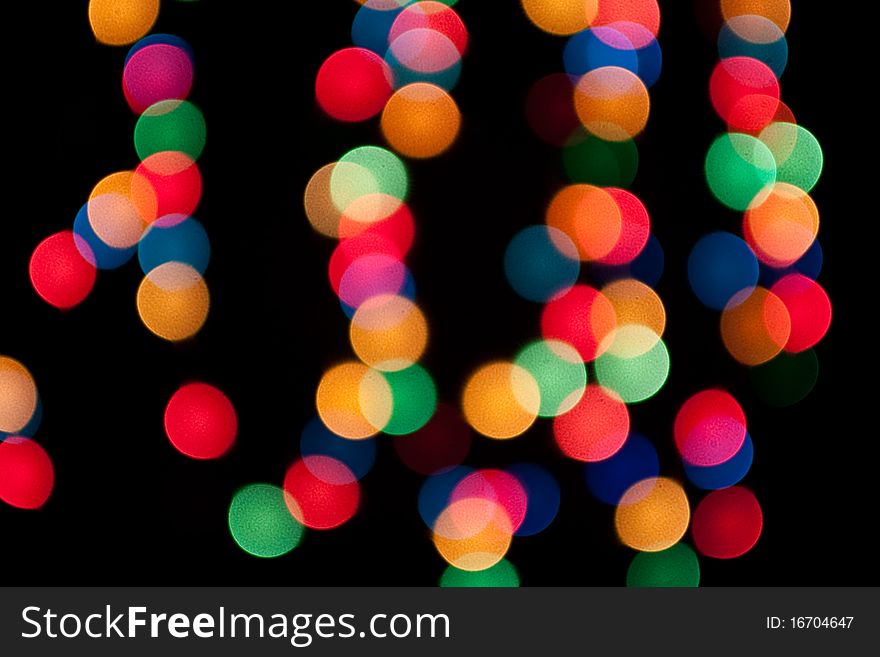 Abstract bokeh lights on a dark background. Abstract bokeh lights on a dark background.