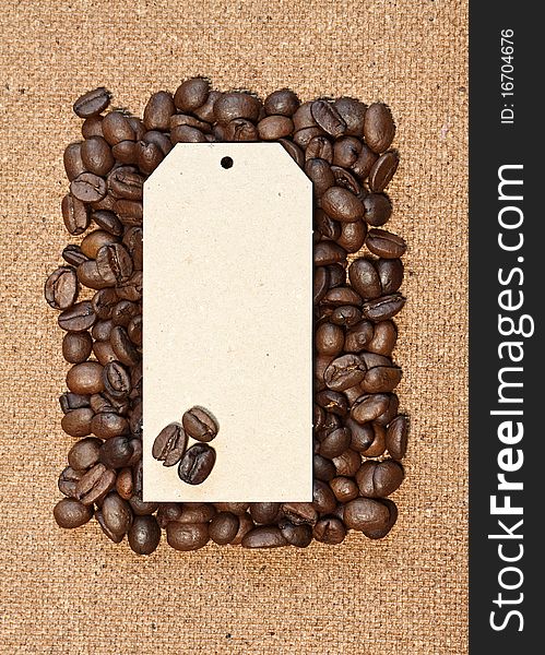 Coffee beans with card on a natural background. Coffee beans with card on a natural background.