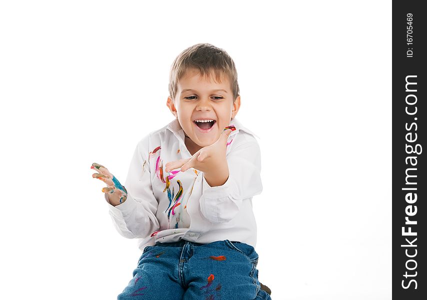 Cute little boy with bright paint