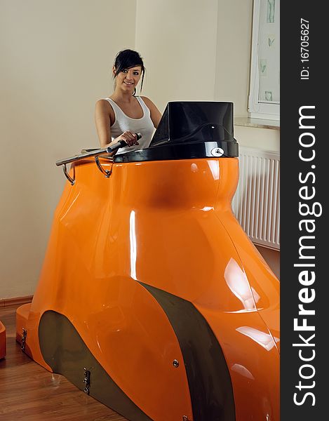 Photo of young woman in fatburning machine. Photo of young woman in fatburning machine