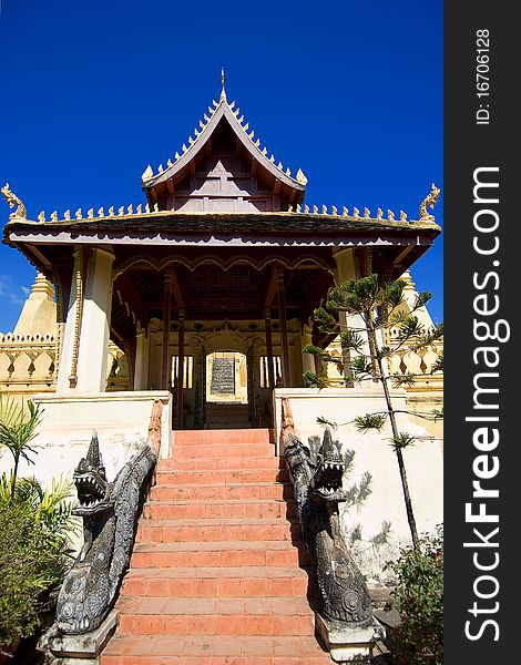 Lao style buddha temple with fresh blue sky. Lao style buddha temple with fresh blue sky.