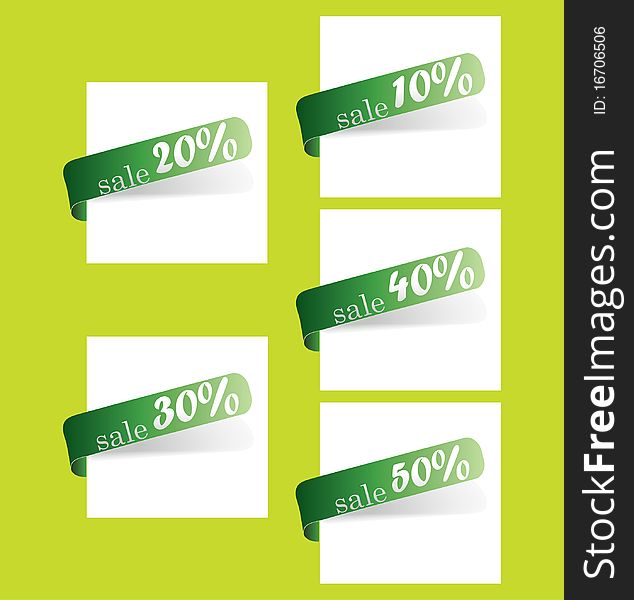 Five green tapes of store discounts in percentage on a white sheet of paper