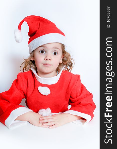 Portrait of little girl in Santa's hat