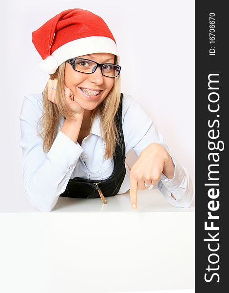 Female santa holding a christmas white card - isolated over a white background