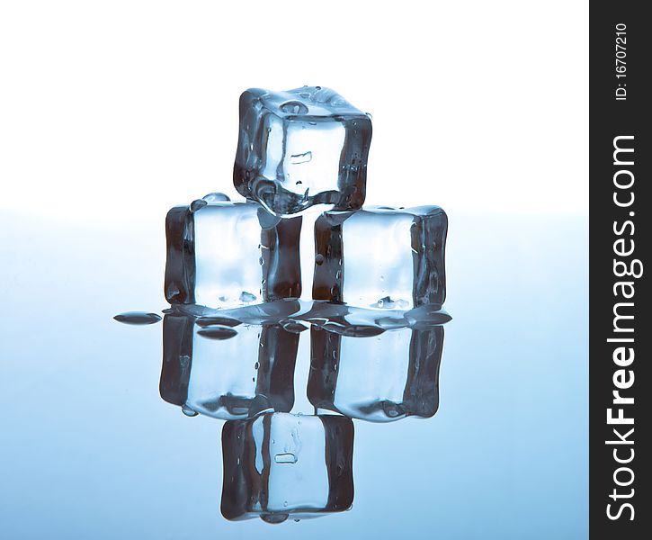 Melting ice cubes on glass table. Melting ice cubes on glass table.