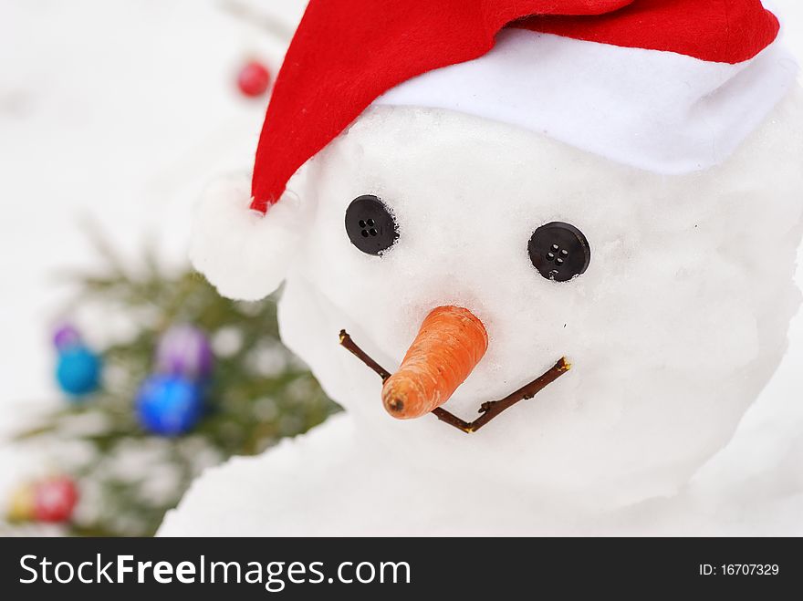 Close-up Smiling Snowman With  Christmas Tree