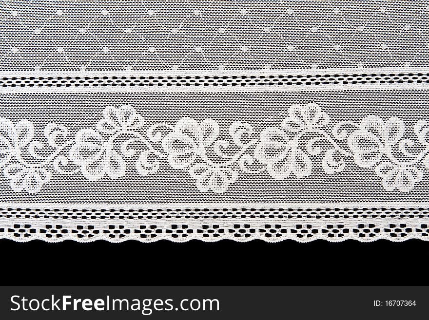 Decorative white lace on insulated black background