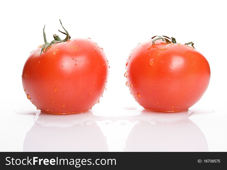 Two Red Tomatoes With Water Drops