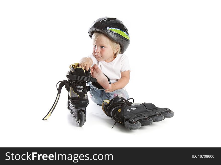 Toddler With Rollerskates Over White