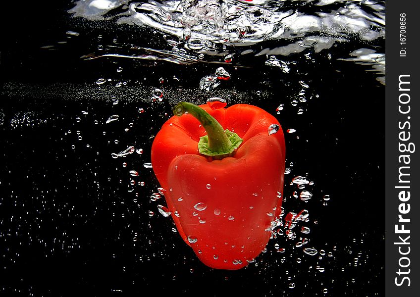 Red Pepper Splashing In Water