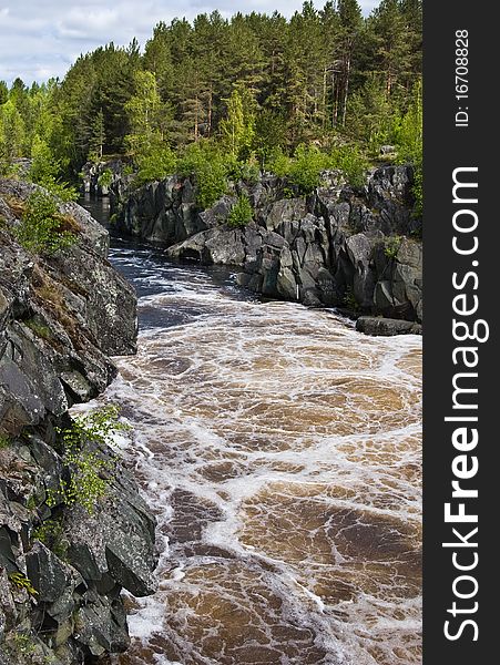 Lower Vyg river in Nadvoitsy settlement, just after Voitsky Padun waterfall, Karelia, Northern Russia.
