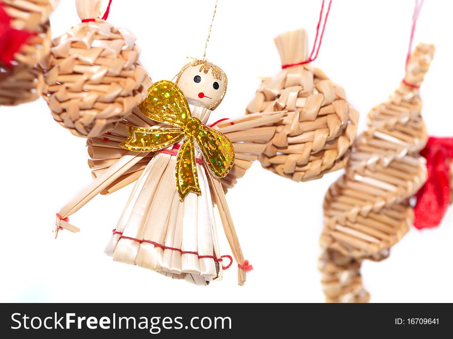 Christmas decorations - straw angel isolated on white