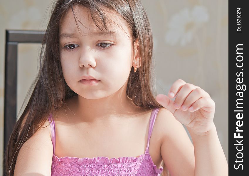 The thoughtful girl. Girl about something thoughtful.