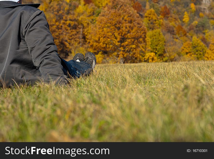 Young man resting on the grass. Young man resting on the grass