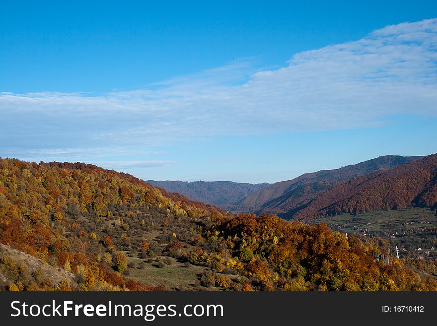 Autumn landscape foliage on blue sky