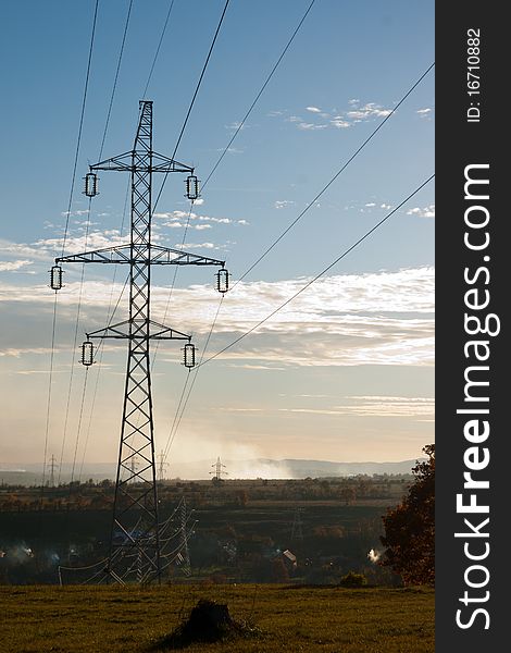 High voltage pylon against blue sky. High voltage pylon against blue sky