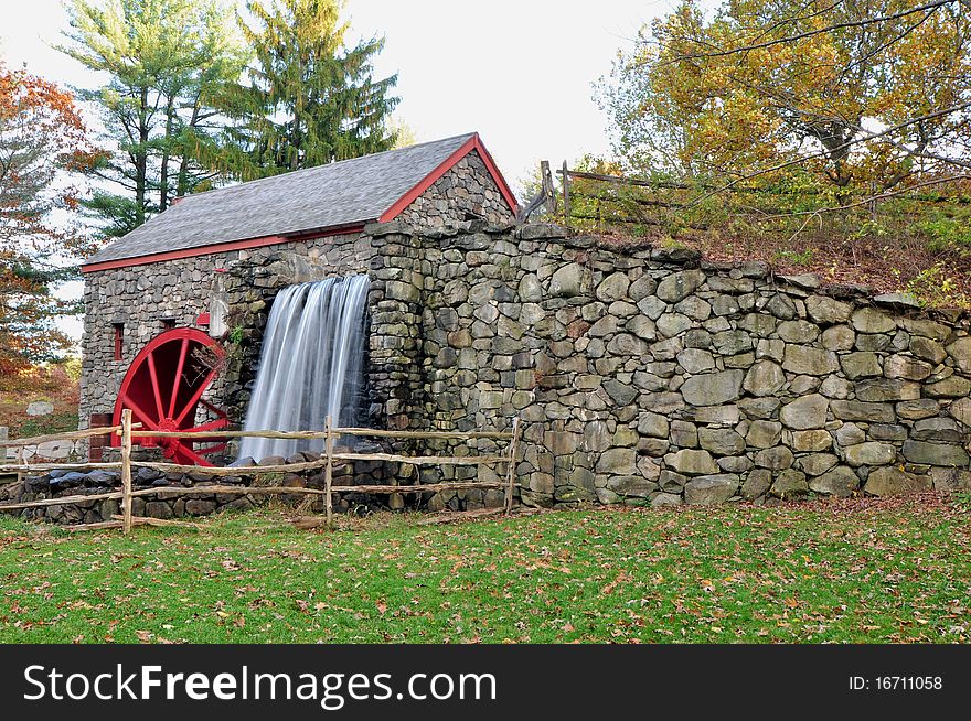 A historic grist mill on a late autumn afternoon in New England. A historic grist mill on a late autumn afternoon in New England