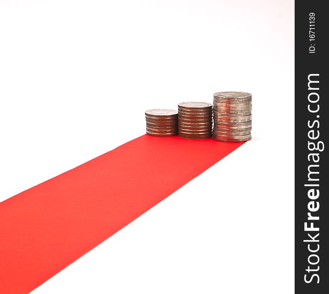 Red carpet and column of coin isolated on white background. Red carpet and column of coin isolated on white background