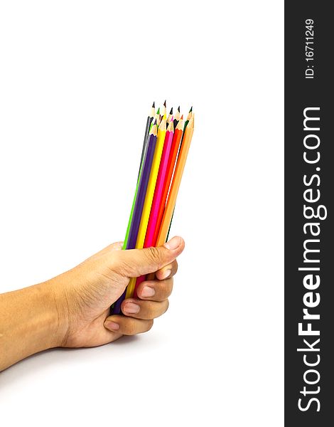 Color pencils in a hand isolated on white background. Color pencils in a hand isolated on white background.