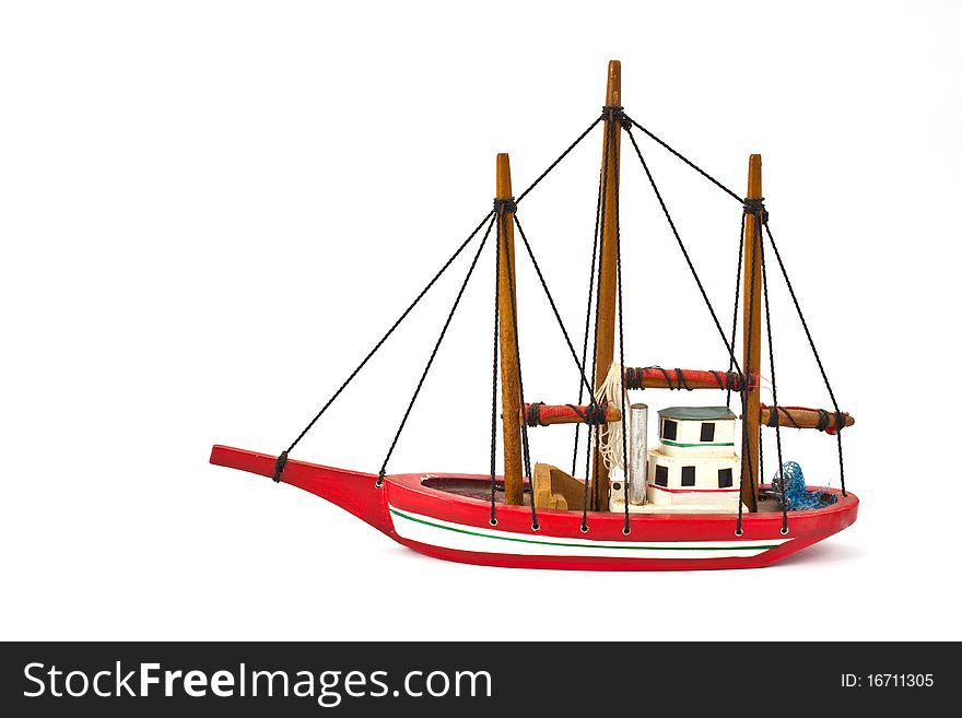 Small model ship isolated on white background. Small model ship isolated on white background
