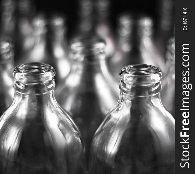 Empty bottles collection, colorless, isolated on black background