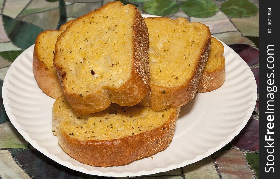 Plate of garlic bread ready as a side for any delicious meal.