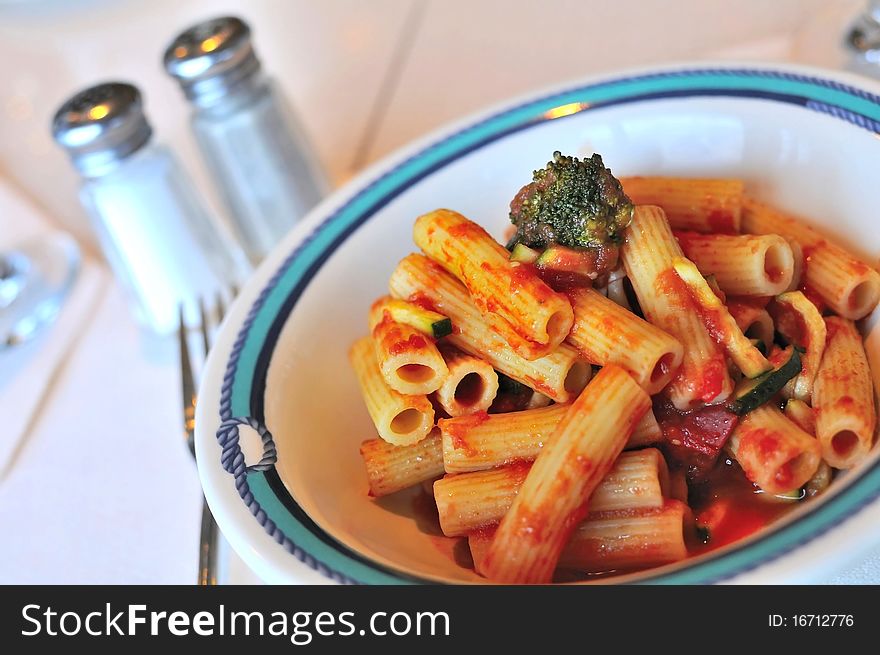 Fusion style tomato pasta cooked with Oriental mixed vegetables.