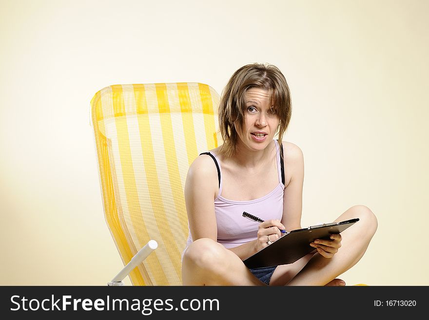 White adult studying documents and writing. White adult studying documents and writing