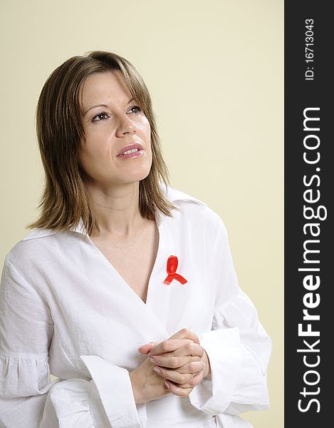 Woman with red sign symbolizing aids crisis. Woman with red sign symbolizing aids crisis