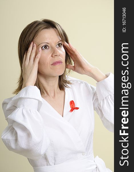 Woman with red sign symbolizing aids crisis and paying tribute to affected people. Woman with red sign symbolizing aids crisis and paying tribute to affected people