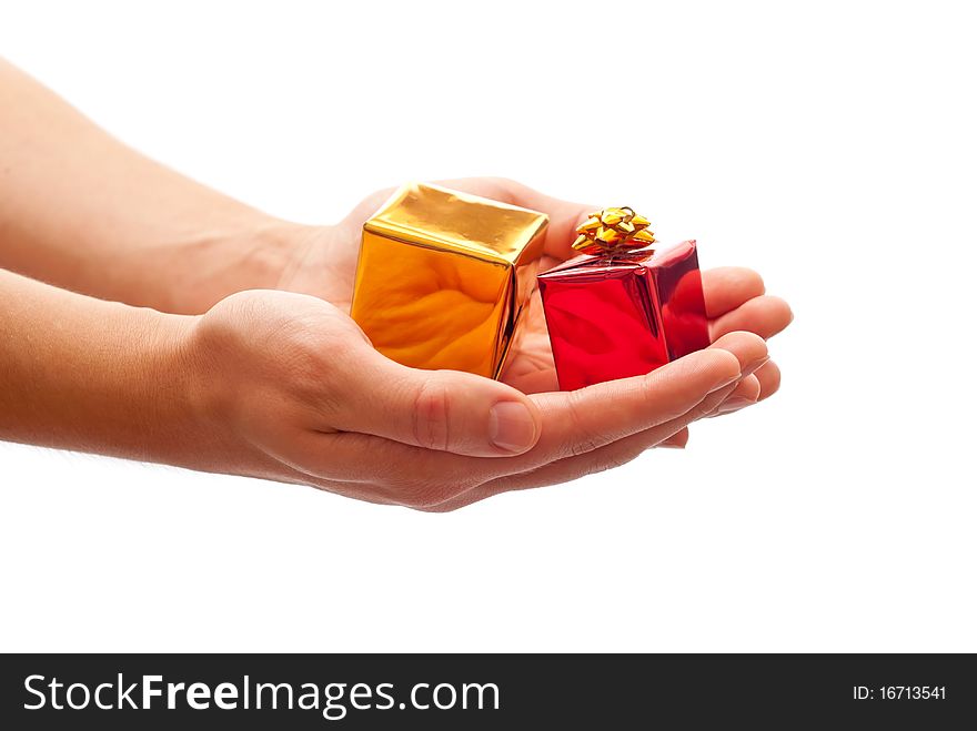 Man's hands holding a gifts. Isolated on white background. Man's hands holding a gifts. Isolated on white background