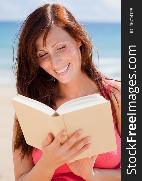 Summer traveltime woman with book with blue sky and sea behind. Summer traveltime woman with book with blue sky and sea behind