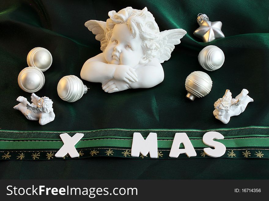 White christmas decorations on a green background