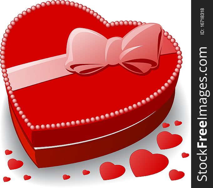 Red heart-shaped box decorated with a bow. Red heart-shaped box decorated with a bow