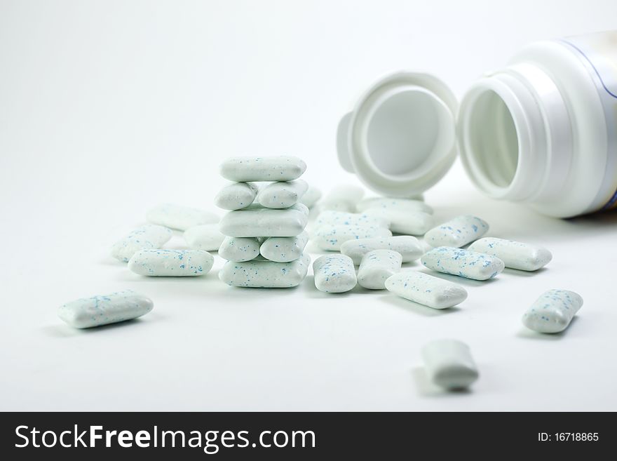 Column of chewing gum on a white background