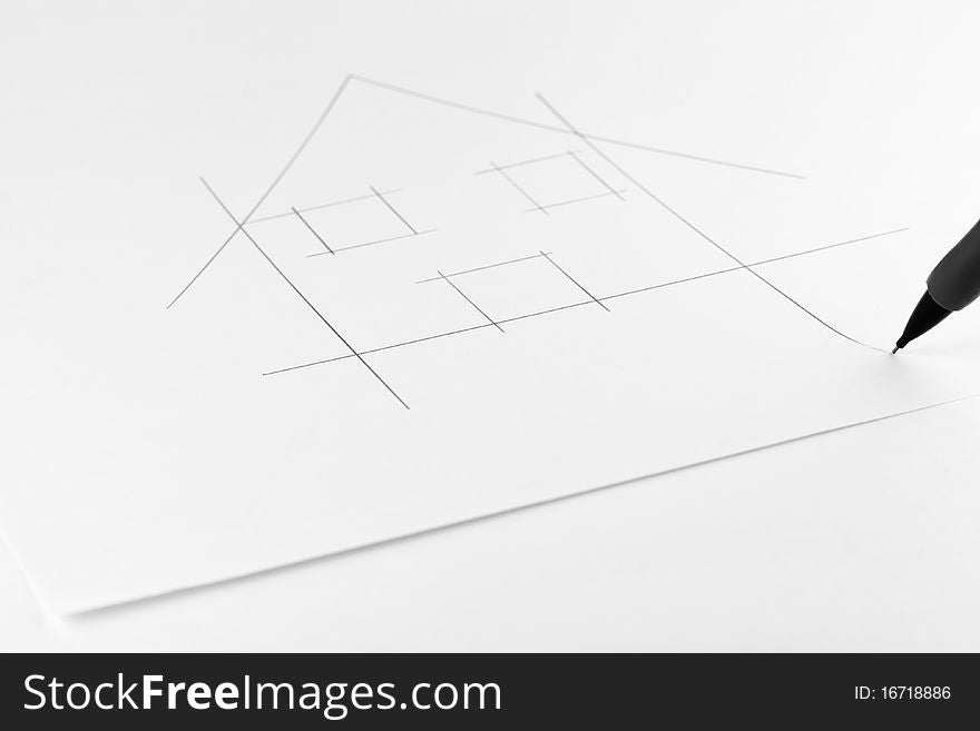 Drawing of a house on a sheet of paper. Drawing of a house on a sheet of paper