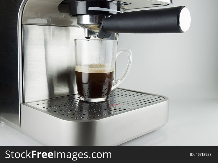 Modern espresso machine make the perfect cup of black coffee. Modern espresso machine make the perfect cup of black coffee