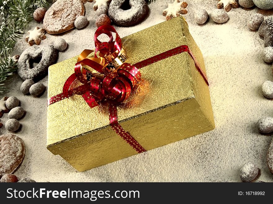 Christmas frame of cookies, stars, balls, snow and a present. Christmas frame of cookies, stars, balls, snow and a present