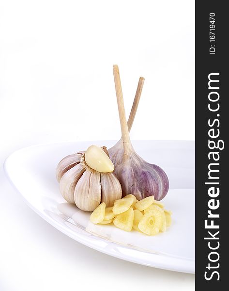 Garlic On A White Dish