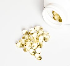 Yellow Pills And A Package Of Pills Isolated Stock Photography Yellow Pills And A Package Of Pills Isolated Stock Photography