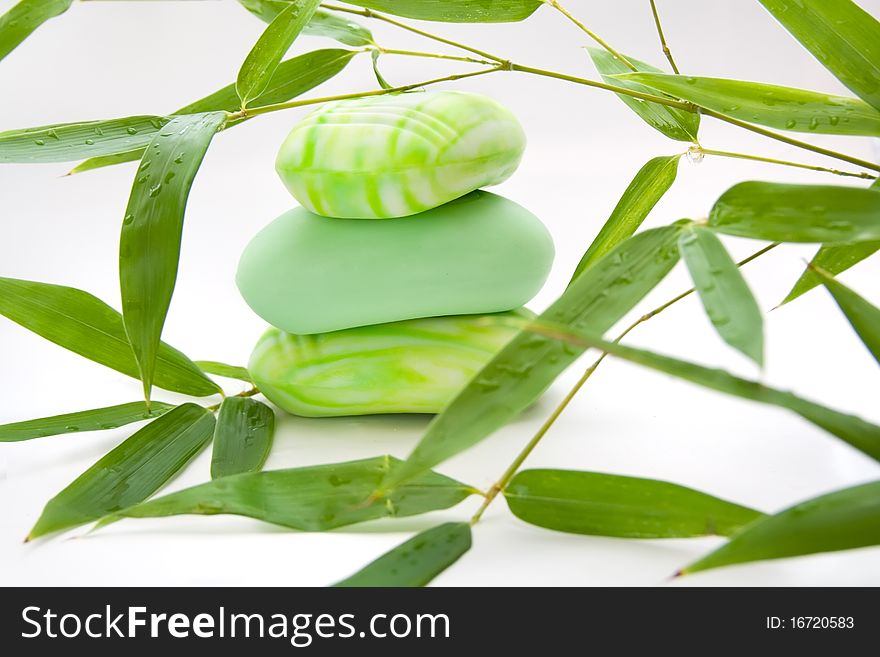 Three pieses of green scented soap with bamboo branches. Three pieses of green scented soap with bamboo branches