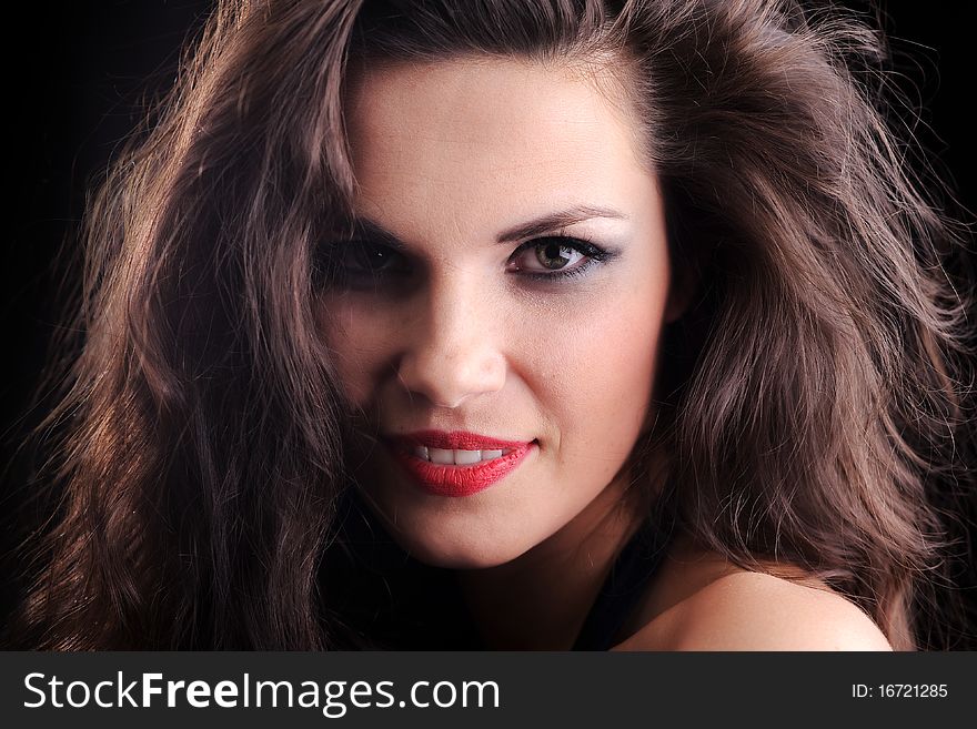 Portrait of smiling pretty young brunette woman