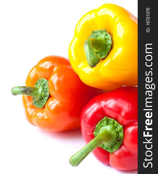 Three colored peppers on a white background. Three colored peppers on a white background