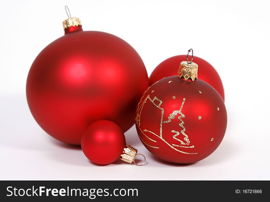 Red glass balls on the white background. Red glass balls on the white background