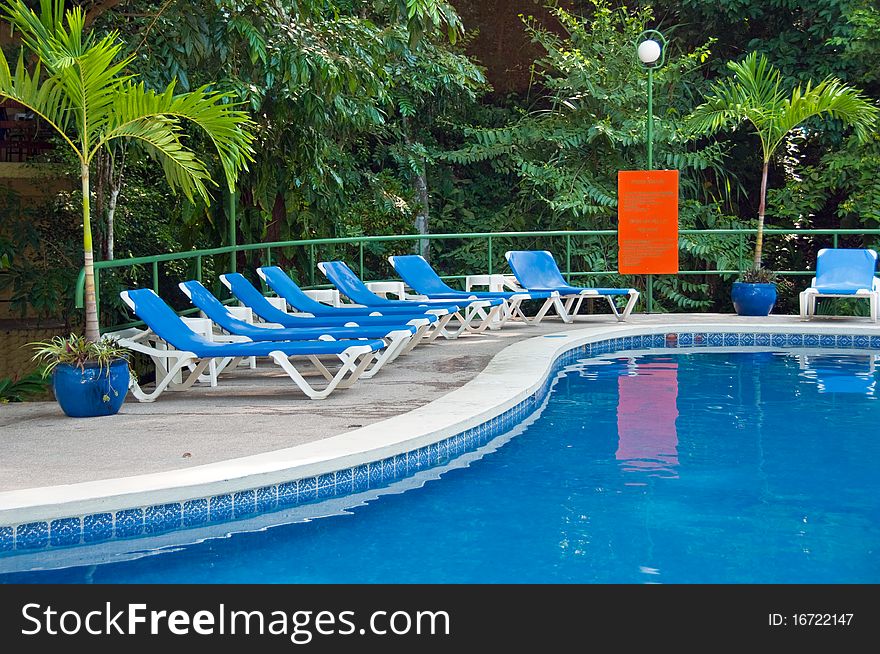 Cool, inviting swimming pool deep in tropical jungle. Cool, inviting swimming pool deep in tropical jungle.
