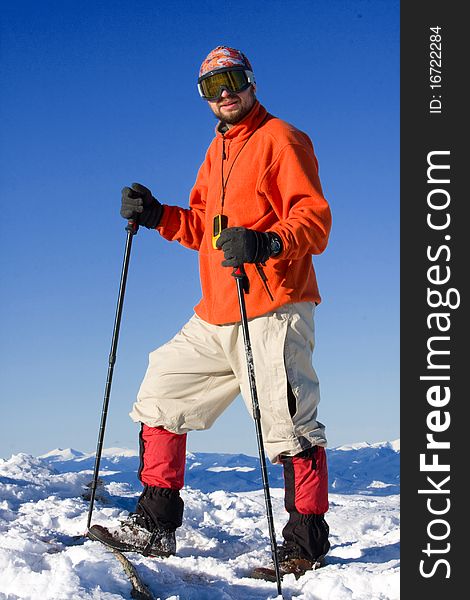 Hiker in winter in mountains