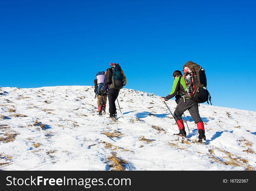 Hiker in winter in mountains